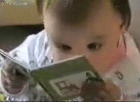 gif: baby reading feverishly 